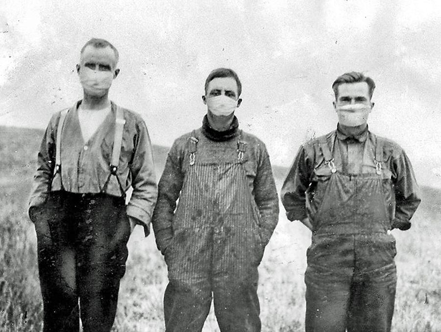 This historic photo depicts men wearing masks during the Spanish Influenza epidemic in 1918. The Woodstock Museum was surprised by the lack of local firsthand accounts and artifacts documenting the epidemic during the final year of the First World War. (Photo from Library and Archives Canada)